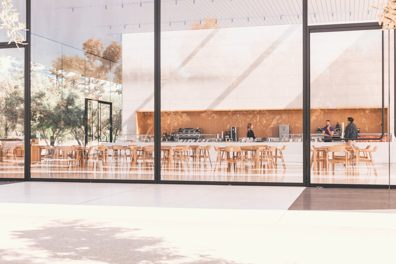 Contemporary café with glass panels and natural light in Cupertino.